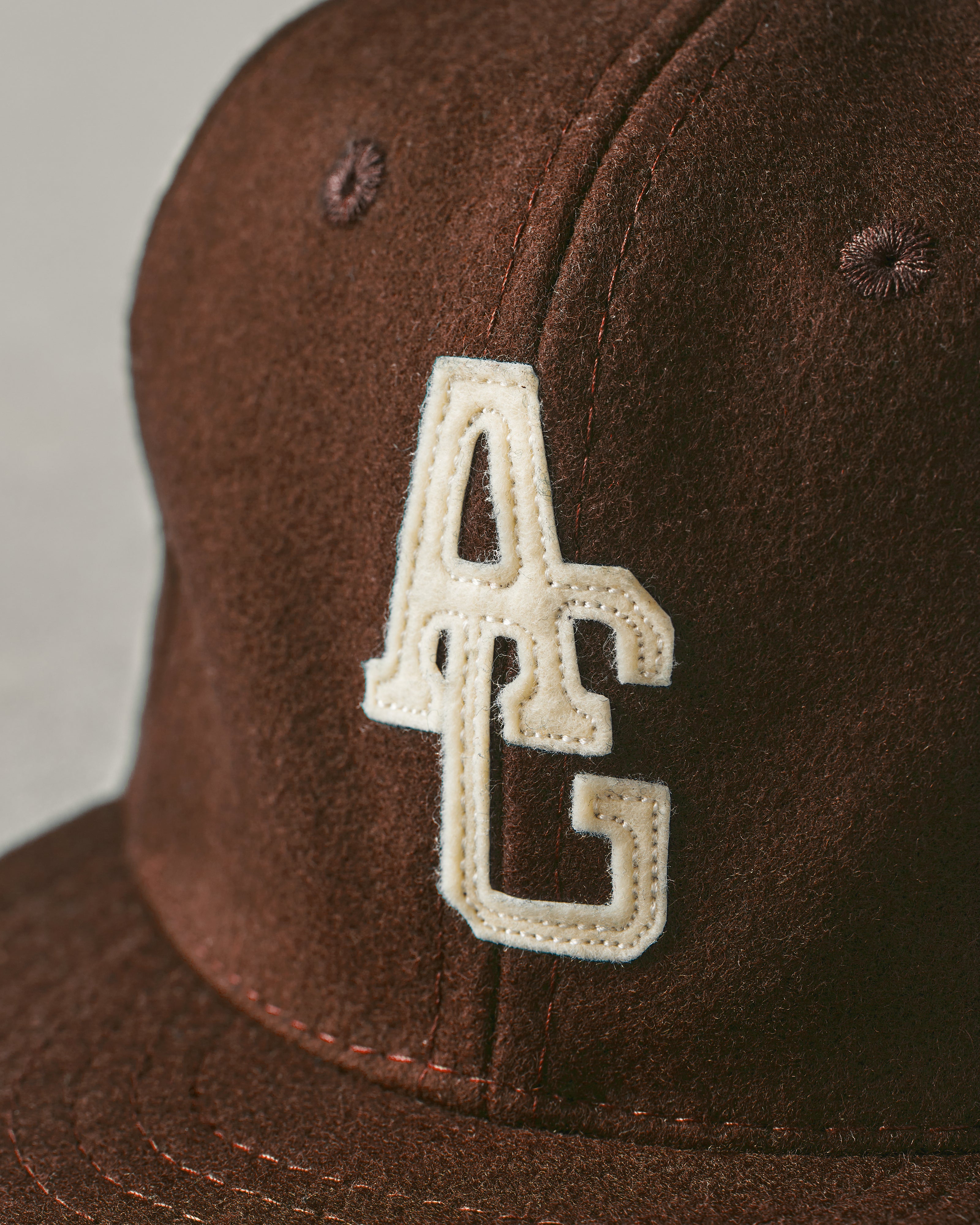 brown fitted hat with patch
