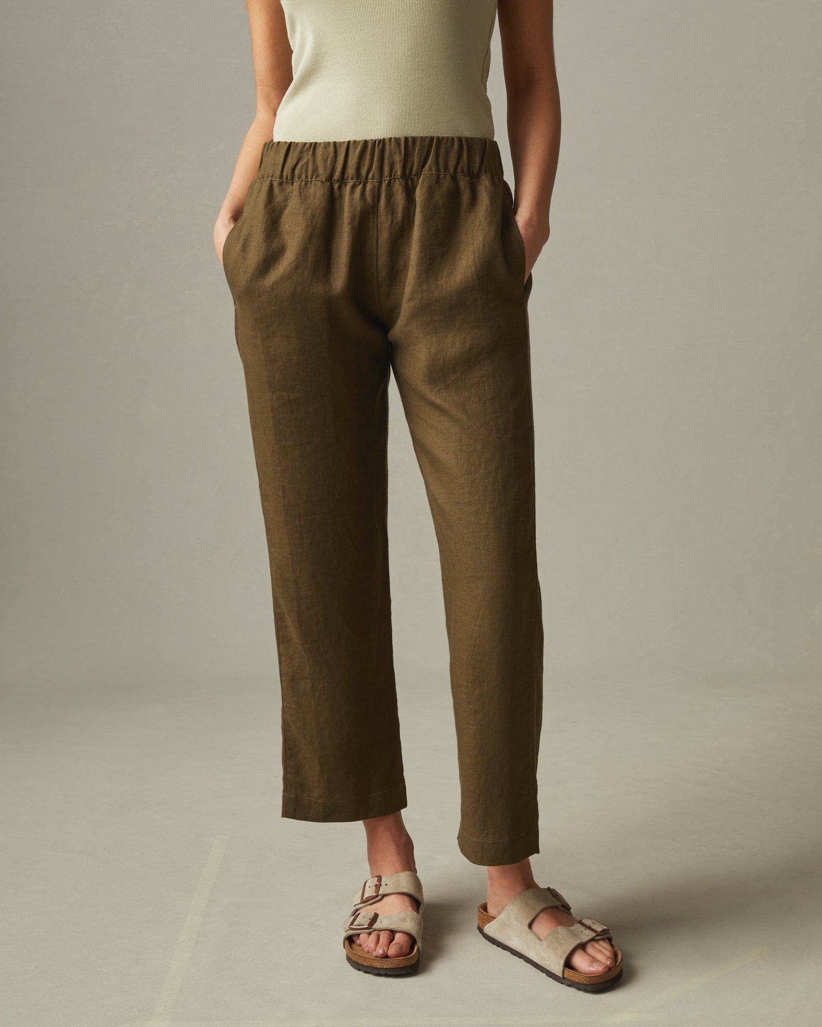 Emma Hill wears brown linen trousers, brown racer back vest top, strappy  sandals, Dragon Diffusion Cann… | Brown pants outfit, Brown linen pants,  Linen pants outfit